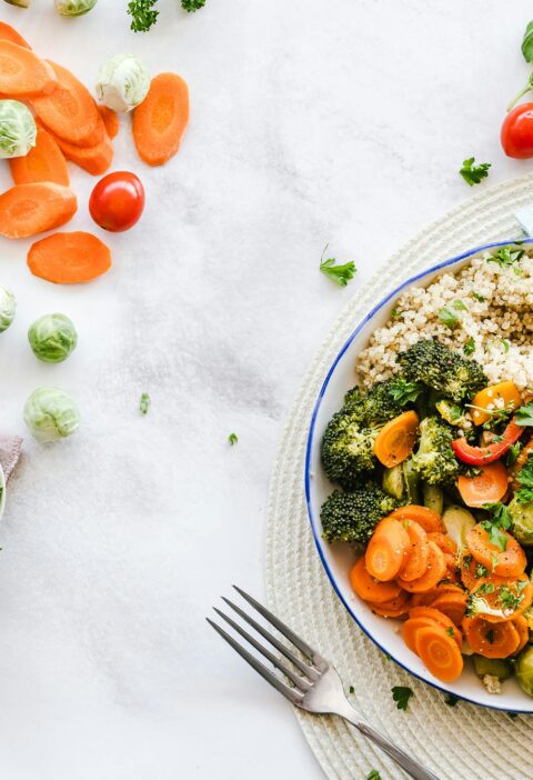 Colorful quinoa salad with fresh vegetables creates a healthy, balanced meal.